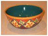A Bali stoneware wide bowl, decorated with geometric design diamonds and triangle shapes in vibrant colour glazes - second view.
