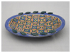 A Bali stoneware oval plate, decorated with a complex geomatric design using colourful glazes - third view.