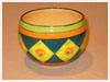 A Bali stoneware jardiniere, decorated with daffodils in diamond shapes and green and orange borders - third view.