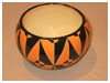 A Bali stoneware geometric design bowl, decorated in triagles using black and orange glazes - second view.