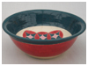 A Bali stoneware wide bowl, decorated with geomatric design using vibrant colour under glazes - third view.