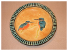 A Bali stoneware deep plate, decorated with a pair of kingfishers - first view.