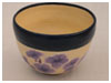 A Bali stoneware bowl, glazed with purple petunia with blue border - third view.