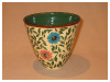 A Bali stoneware vase, decorated with large daisies and leaves - first view